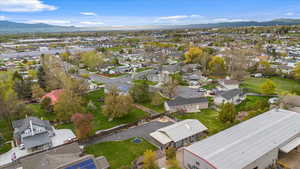 Drone / aerial view with a residential view and a mountain view