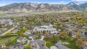 Birds eye view of property featuring a mountain view and a residential view