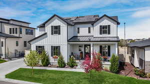 This bright and modern farmhouse exudes crisp, clean design while embracing sustainability with sleek solar panels. A perfect blend of timeless charm and eco-friendly innovation.