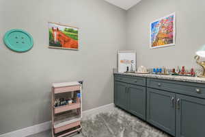 A dedicated craft room featuring beautifully built-in custom cabinetry, offering stylish and functional storage for all your creative essentials.