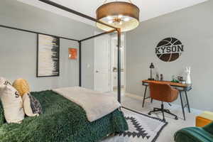 A well-appointed second-level bedroom with convenient access to a shared Jack and Jill bathroom.