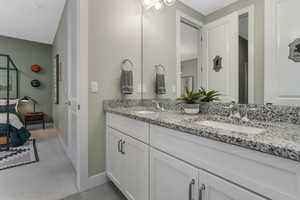 A shared Jack and Jill bathroom conveniently situated between two bedrooms, offering easy access and functionality.