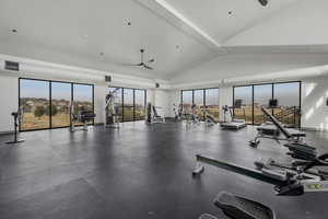 Spacious gym offering stunning views of the city and mountains.