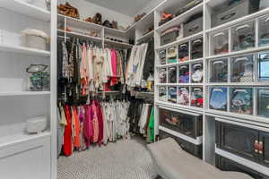 This custom closet offers ample space to accommodate your needs, combining style with smart organization.