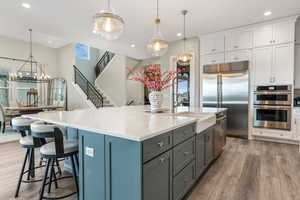 Who wouldn't love this 10' quartz island with a farmhouse sink?