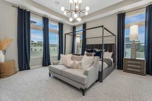 A spacious primary bedroom filled with abundant natural light, creating a bright and inviting retreat.