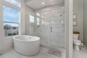 A luxurious soaker tub paired with a sophisticated Euro-style shower, offering both comfort and elegance.