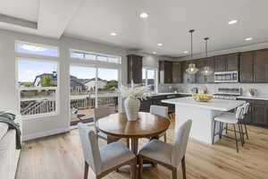 Dining area featuring light wood-style floors, recessed lighting, and baseboards