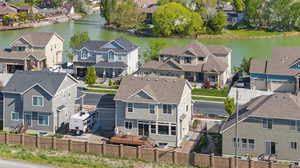 Bird's eye view with a water view and a residential view