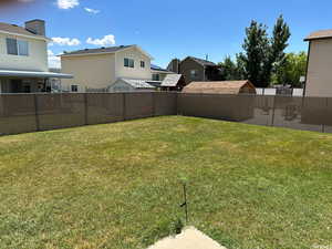 View of yard featuring a residential view and a fenced backyard