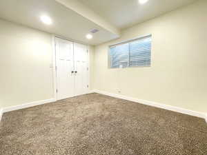 Unfurnished bedroom with baseboards, visible vents, recessed lighting, a closet, and carpet floors