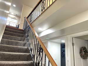 Stairway featuring recessed lighting