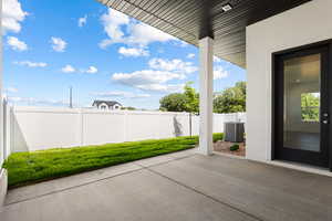 Fenced backyard featuring a patio