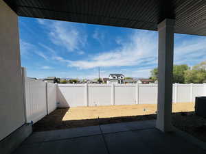 View of patio / terrace with a fenced backyard, a residential view, and cooling unit