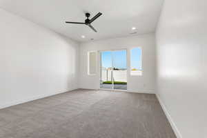 Unfurnished room featuring carpet flooring, ceiling fan, and recessed lighting