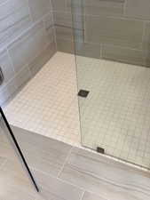 Full bathroom with a tile shower