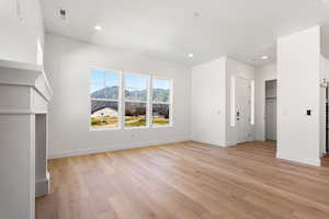 Unfurnished bedroom featuring light wood-style floors and recessed lighting