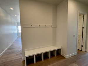 Mudroom with recessed lighting, wood finished floors, and baseboards