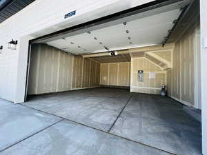 Garage with a garage door opener and electric panel
