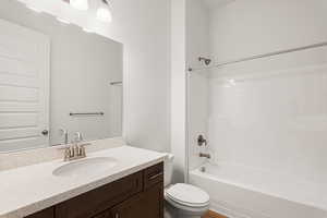 Bathroom with vanity and shower / washtub combination