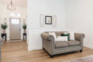 Foyer featuring baseboards and light wood-style flooring
