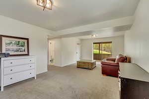 Interior space with light carpet and baseboards