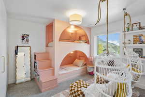 Bedroom with carpet and custom bunk beds