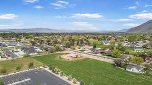 Birds eye view of property with a mountain view and a residential view