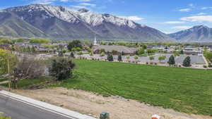 Property view of mountains with a residential view