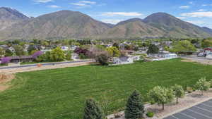 Property view of mountains with a residential view