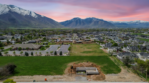 Aerial view at dusk featuring a residential view and a mountain view