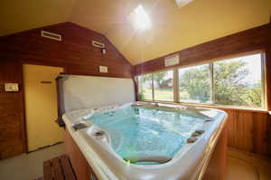 View of pool with an indoor hot tub