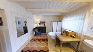 Bathroom with beam ceiling, tile patterned flooring, and wood ceiling