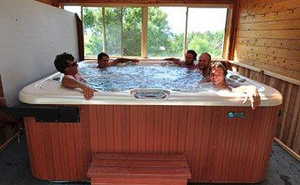 Exterior space with a hot tub