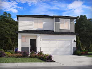 Contemporary house with concrete driveway, an attached garage, and board and batten siding