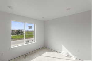 Bedroom featuring large window with mountain view