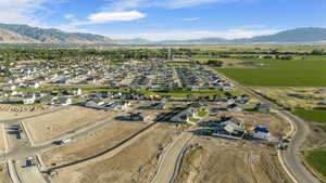 Birds eye view of property with a mountain view and a residential view