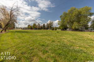 View of yard with a rural view