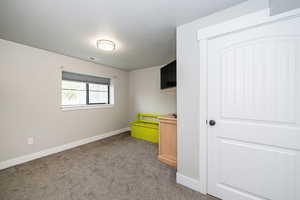 bedroom featuring visible vents, carpet, and baseboards