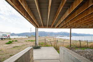 View of patio / terrace with a mountain view and fence, under deck. second walk out.