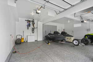 Garage featuring a garage door opener