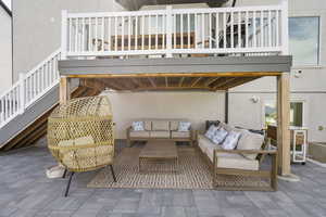 View of patio featuring stairway and an outdoor hangout area
