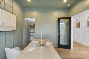 Office space featuring recessed lighting, walk-in closet, and light wood-type flooring.