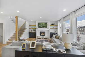 Living area featuring stairway, recessed lighting, and light wood finished floors