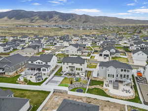 Drone / aerial view featuring a mountain view and a residential view