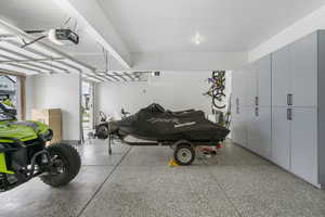 Garage featuring a garage door opener