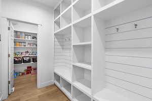 Mudroom with light wood-style flooring