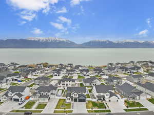 Drone / aerial view with a residential view and a water and mountain view