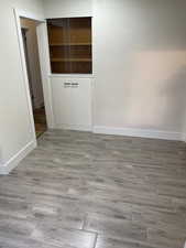 Empty room with wood finished floors and baseboards