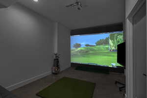 Game room featuring baseboards, recessed lighting, and golf simulator